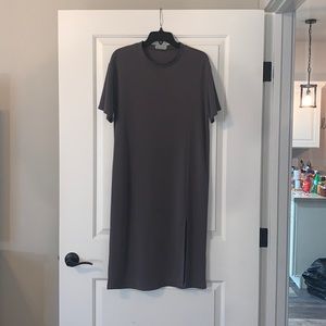 Cute, cotton, dark green dress, with a sleek slit.